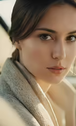 a woman looking at the camera with a serious look on her face