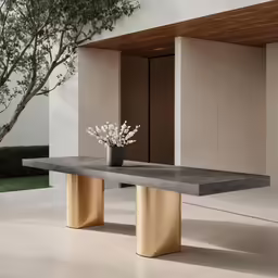 a vase on top of a marble table