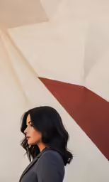 a person is standing against a wall and looking up
