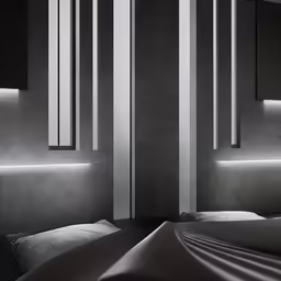 a bed sitting next to a wall filled with lighting