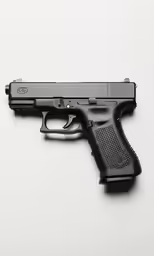 a gun sitting on top of a table