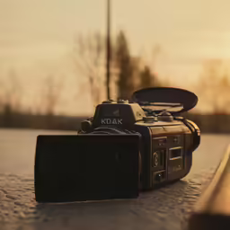 a picture of an old camera sitting on the road