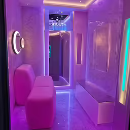 the pink room is lit up by colorful lights