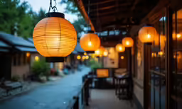 many lights hanging from the outside of a building