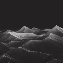 mountains are shown from the top of a hill