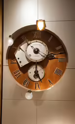 an unusual looking clock mounted to a wall