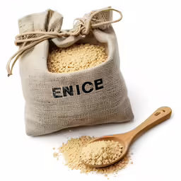 a small sack of sand next to a wooden spoon