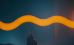 a bird flies over the street light at night