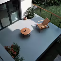 two chairs and a table on a terrace