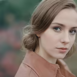 there is a woman that has a brown shirt