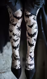 a person is standing in high heels and stockings