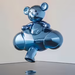 the bear sculpture is sitting on the table