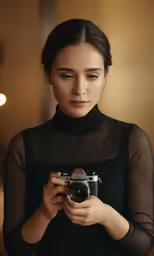 a young asian woman is using a digital camera