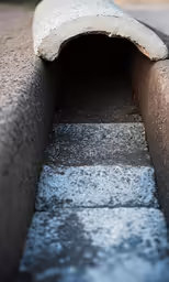 the stairs are concrete with a gray color