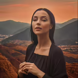 the woman with her hands together looking at the view