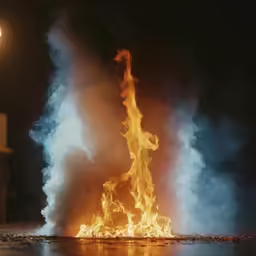 fire is burning as it is pouring out water