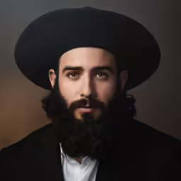 an afghan man with a beard wearing a black hat