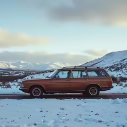the red station wagon sits parked in the snow