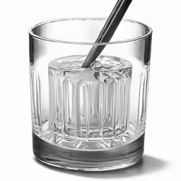 a glass with a toothbrush inside it