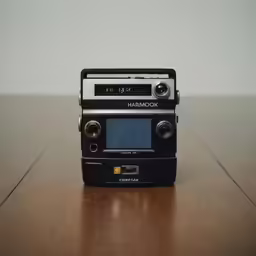 a radio sits on top of a wooden table
