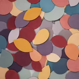 a pile of colorful colored papers are scattered together
