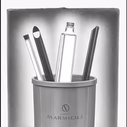 the small container has many pens, pens and makeup bottles