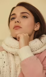 a woman in a pink sweater is looking up