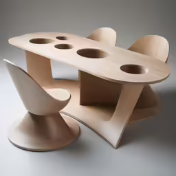 two tables and one chair shaped like an egg pod