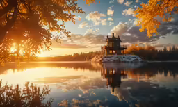 the sun is shining on the sky over a lake