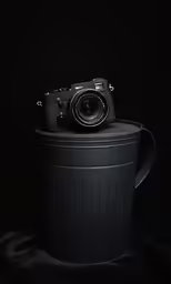 a photo camera in a trash can