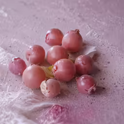 fruit on a table with white paper under it
