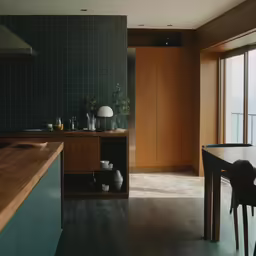 a black dining table and wood shelves with wooden floors