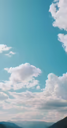 some sky and some water with green hills and trees