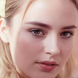 a woman with long blonde hair wearing a flower on her head