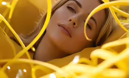 a blonde haired woman laying on the ground