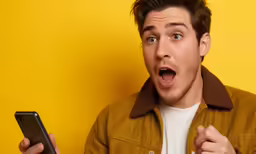an excited man is making his own phone gesture