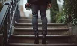 the young lady is walking down the stairs
