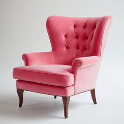 the pink velvet chair is on display