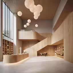 a large room with some stairs and tables inside