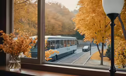 a window that has a large bus next to it