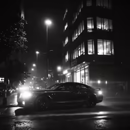 two cars are parked on a busy street in the fog