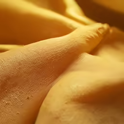 an image of close up on bananas with yellow background