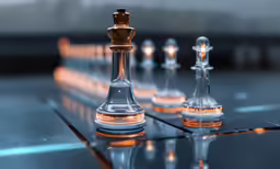 a glass chess board with several pieces standing in the middle