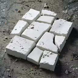 pieces of clay are sitting on the ground