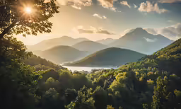 the sun shines on mountains behind a lake