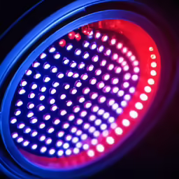close up view of a light fixture, lit with red and blue lights