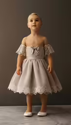 a girl wearing a dress with a bow at the waist