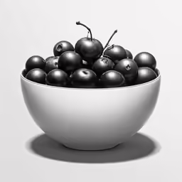 a bowl full of black fruits sitting on top of a white table
