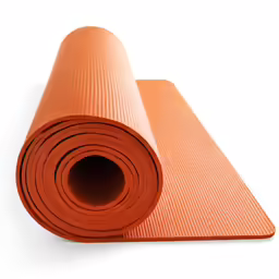 a pair of yoga mats with the top rolled up on the floor