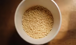 bowl of cereal on table with light reflecting
